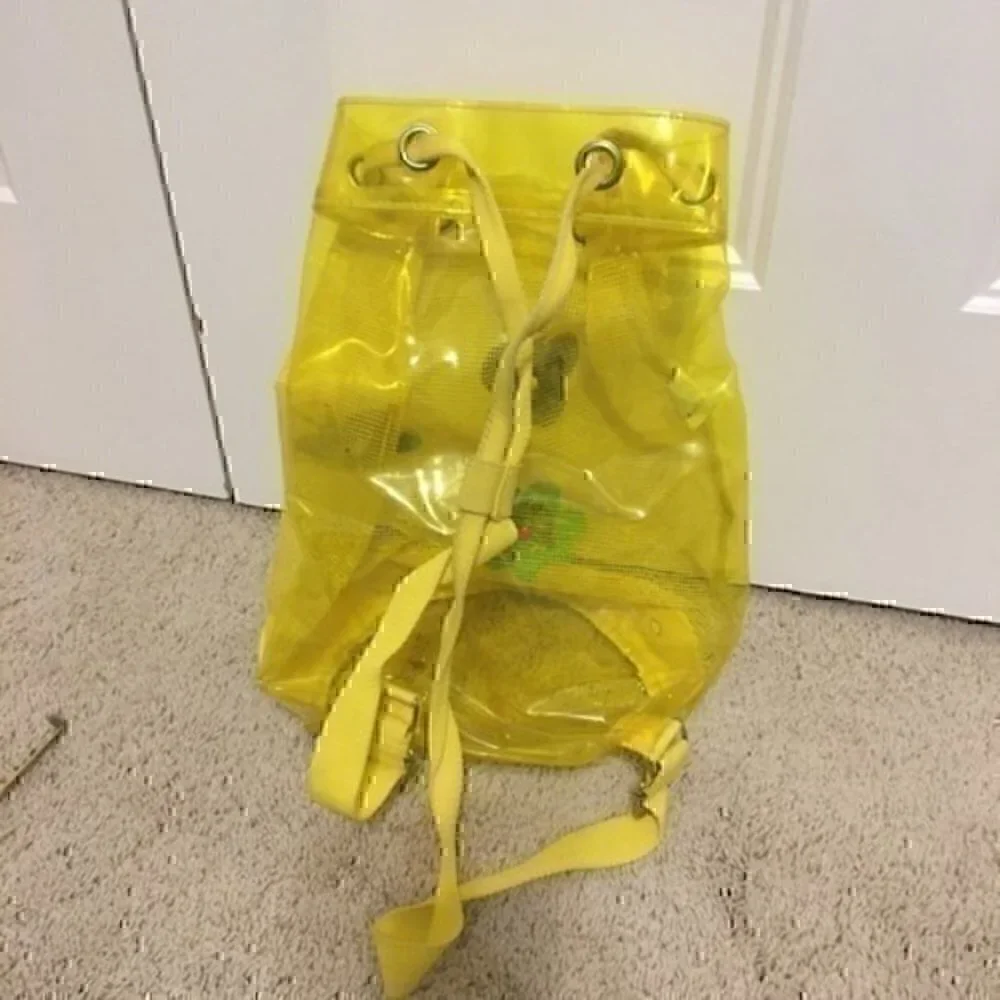 Girl’s yellow beach bag
